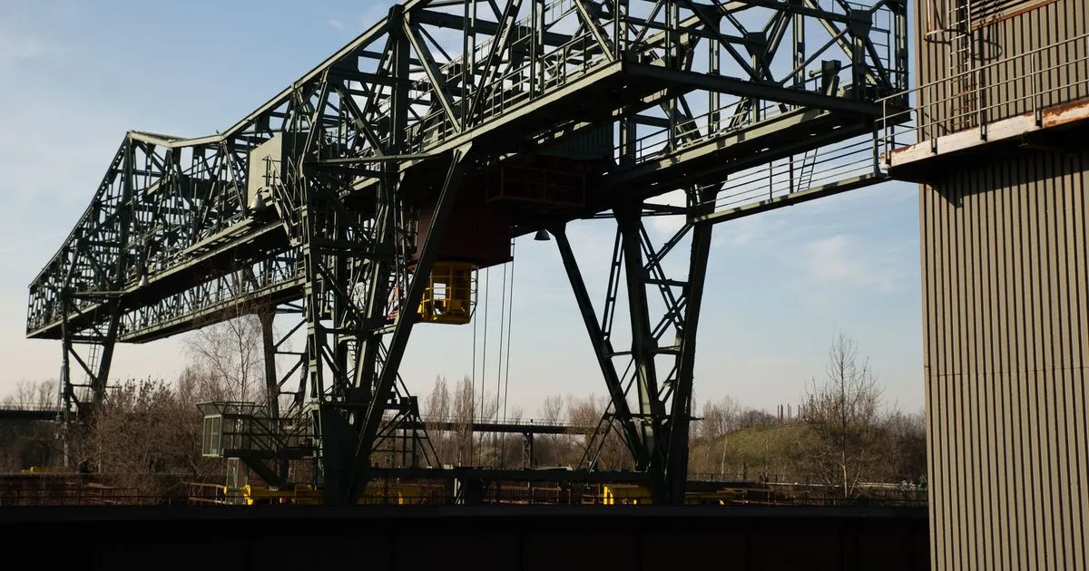 Steel truss gantry crane with legs and a bridge girder against the sky, an example of gantry crane structure fabrication
