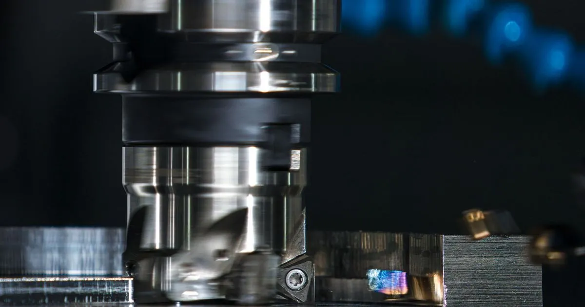 Face milling cutter cutting a flat steel surface, an example of post weld machining allowance work on a large weldment